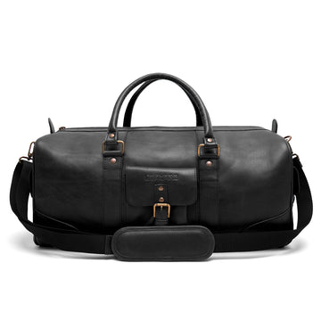 Falcon Leather Duffle Bag on a bench, showing full-grain leather and compact form.