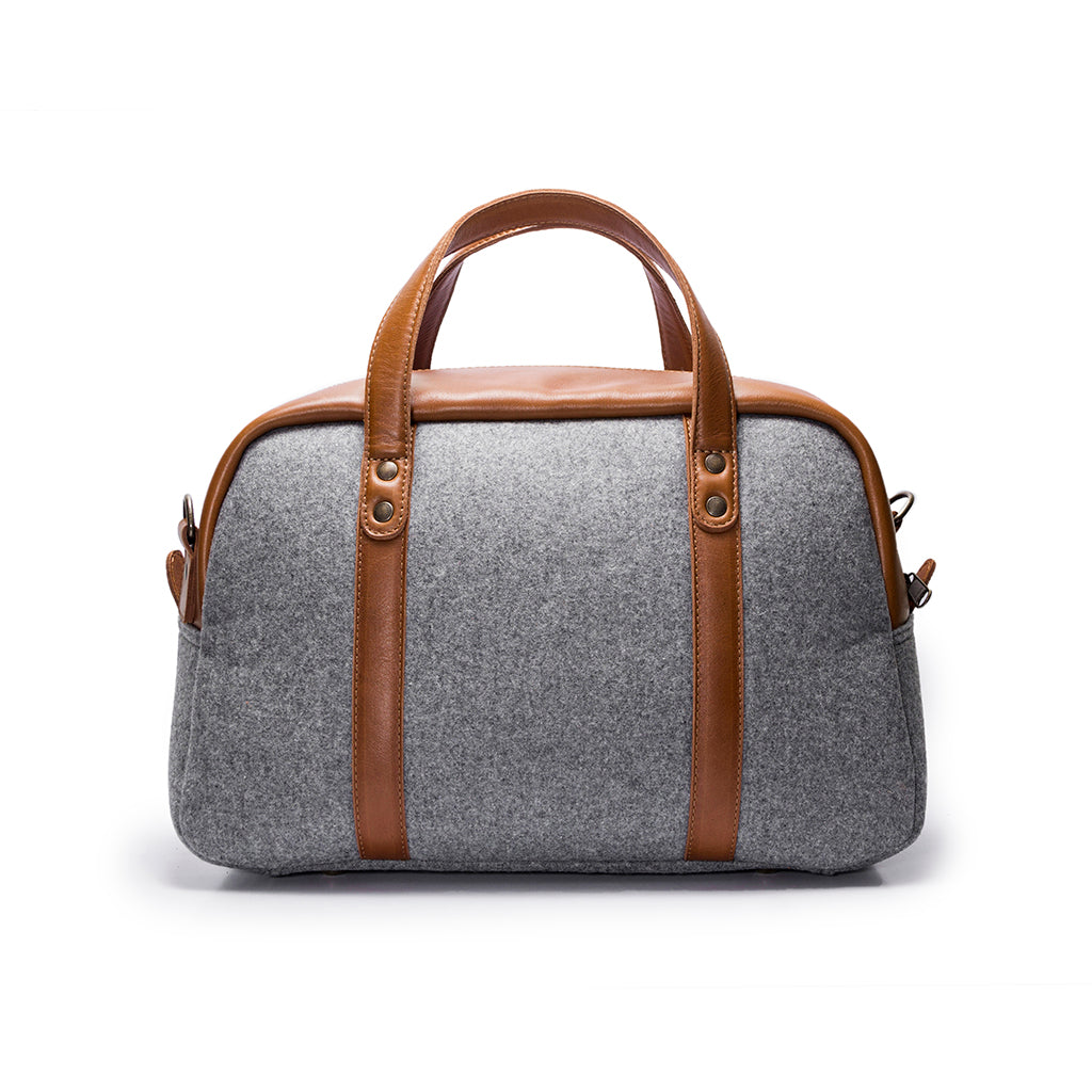 Leather weekender bag combining luxury materials and practicality
